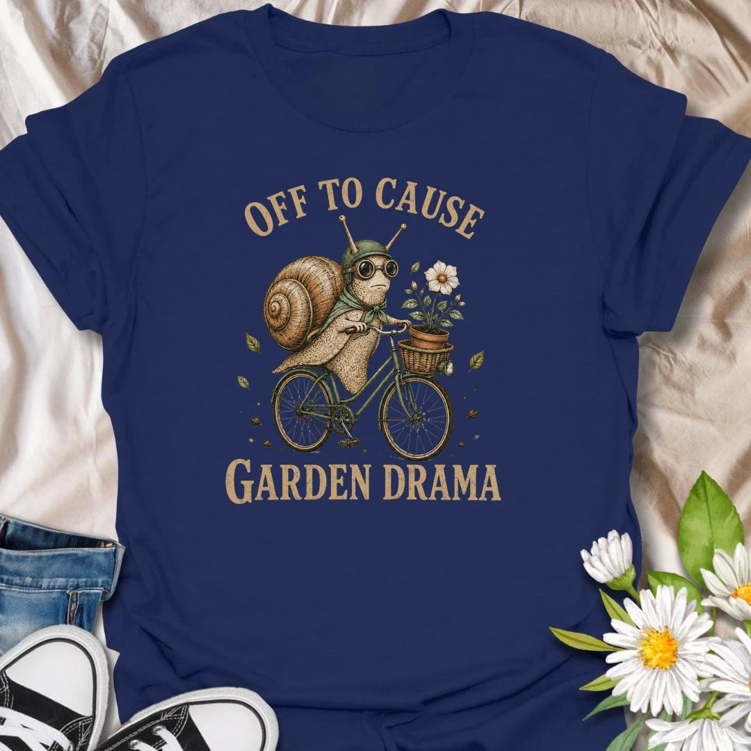 This Off To Cause Garden Drama t-shirt is perfect for gardeners, snail lovers, and plant people with a playful sense of humor. Featuring a vintage-style snail riding a bicycle with a flower pot and botanical details, this funny garden design is great for plant lovers, cottagecore fans, nature lovers, and anyone who enjoys whimsical garden chaos.