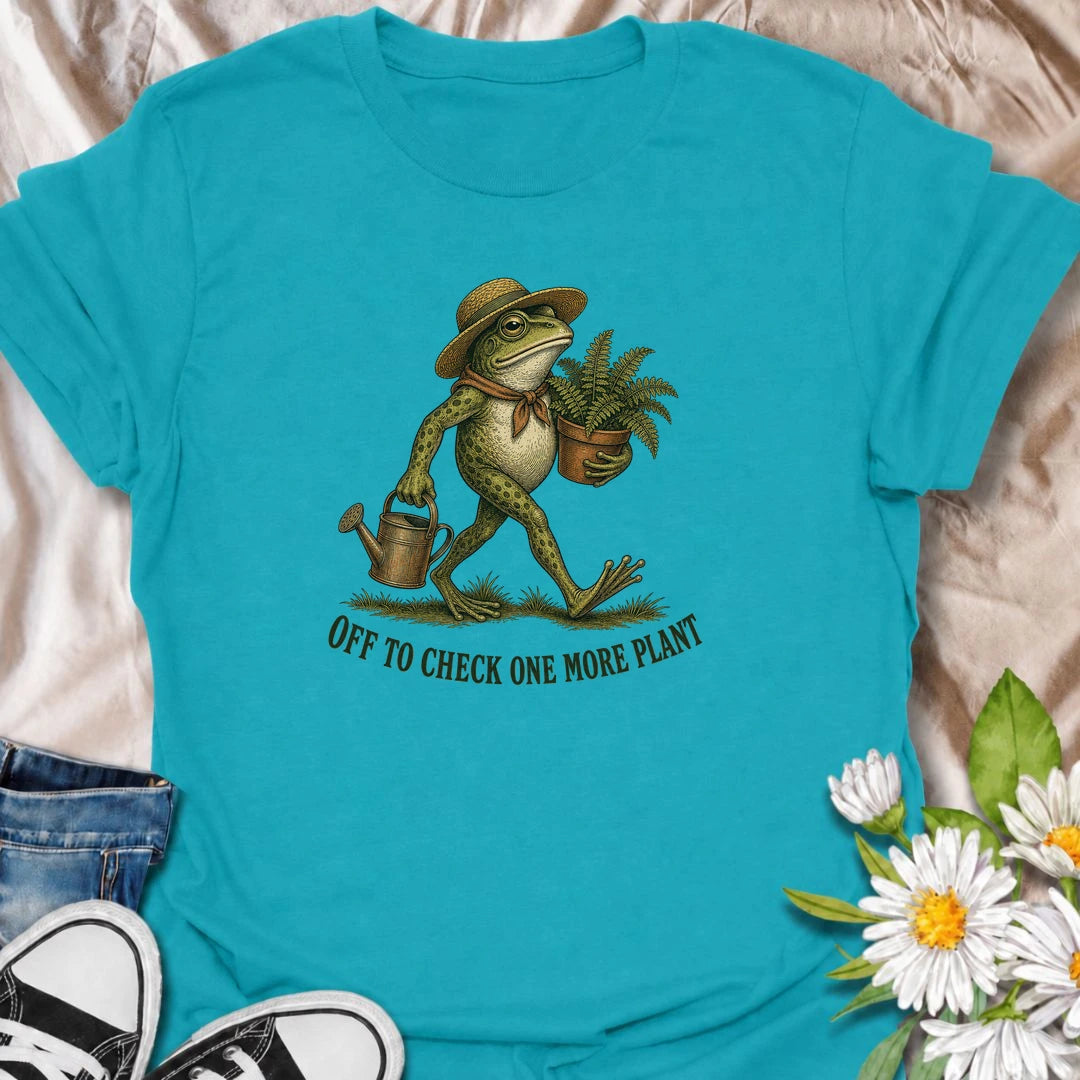 A funny plant T-shirt for anyone who can never resist checking on just one more plant. Featuring a charming vintage-style frog carrying a fern and watering can, this design is perfect for plant parents, gardeners, and nursery regulars. The phrase “Off to Check One More Plant” captures the familiar habit of turning a quick plant check into a much longer wander. It makes a great gift for houseplant lovers, garden enthusiasts, frog lovers, and anyone whose plants get more attention than most people. Ideal for 