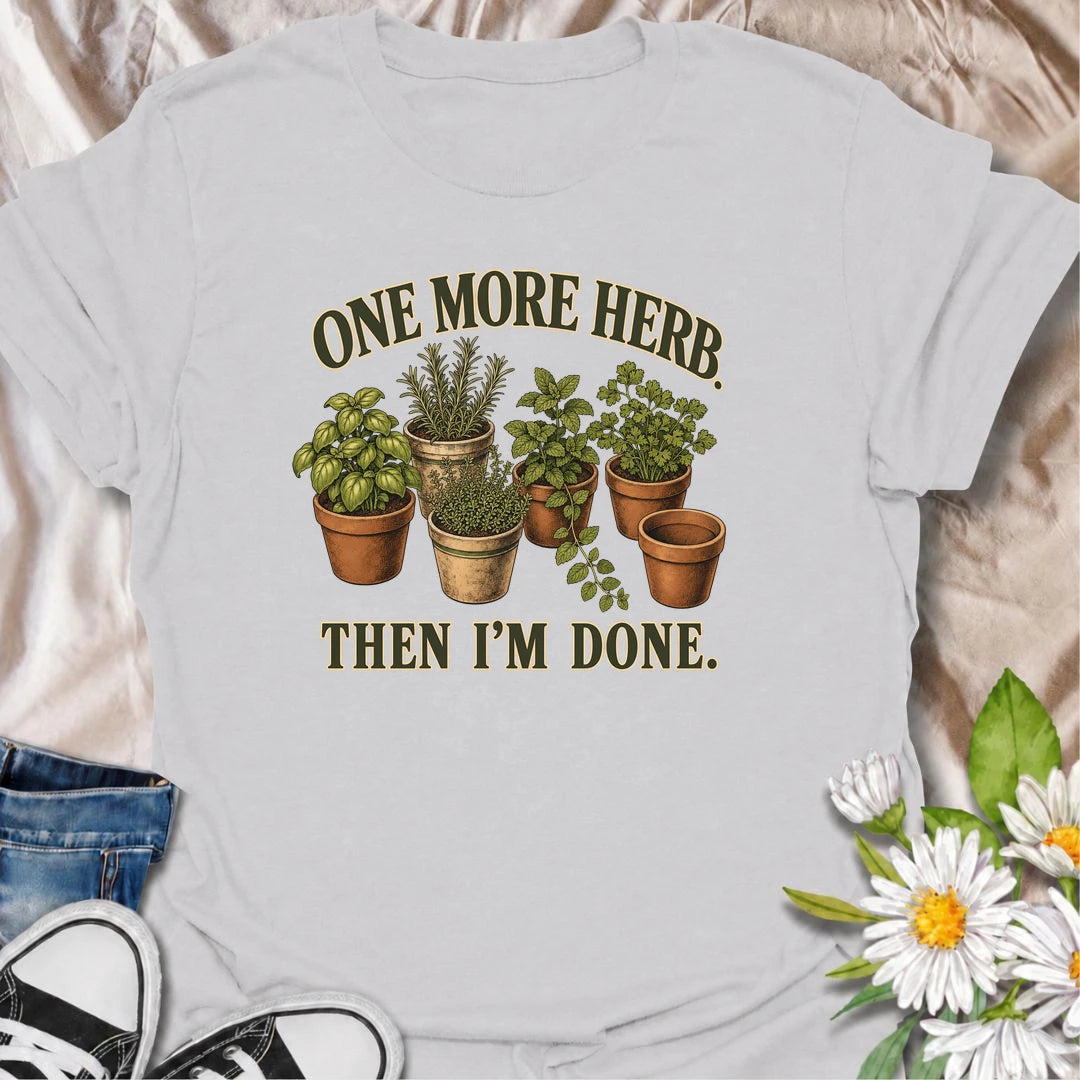 A funny herb garden T-shirt for anyone who keeps promising there is room for just one more pot. Featuring basil, rosemary, mint, thyme, and parsley in vintage-style planters, this design is perfect for kitchen gardeners and herb lovers. The phrase “One More Herb. Then I’m Done.” captures the very familiar habit of turning a small herb collection into an ever-growing one. It makes a great gift for home cooks, container gardeners, and anyone who loves growing fresh herbs. Ideal for gardening days, farmers mar
