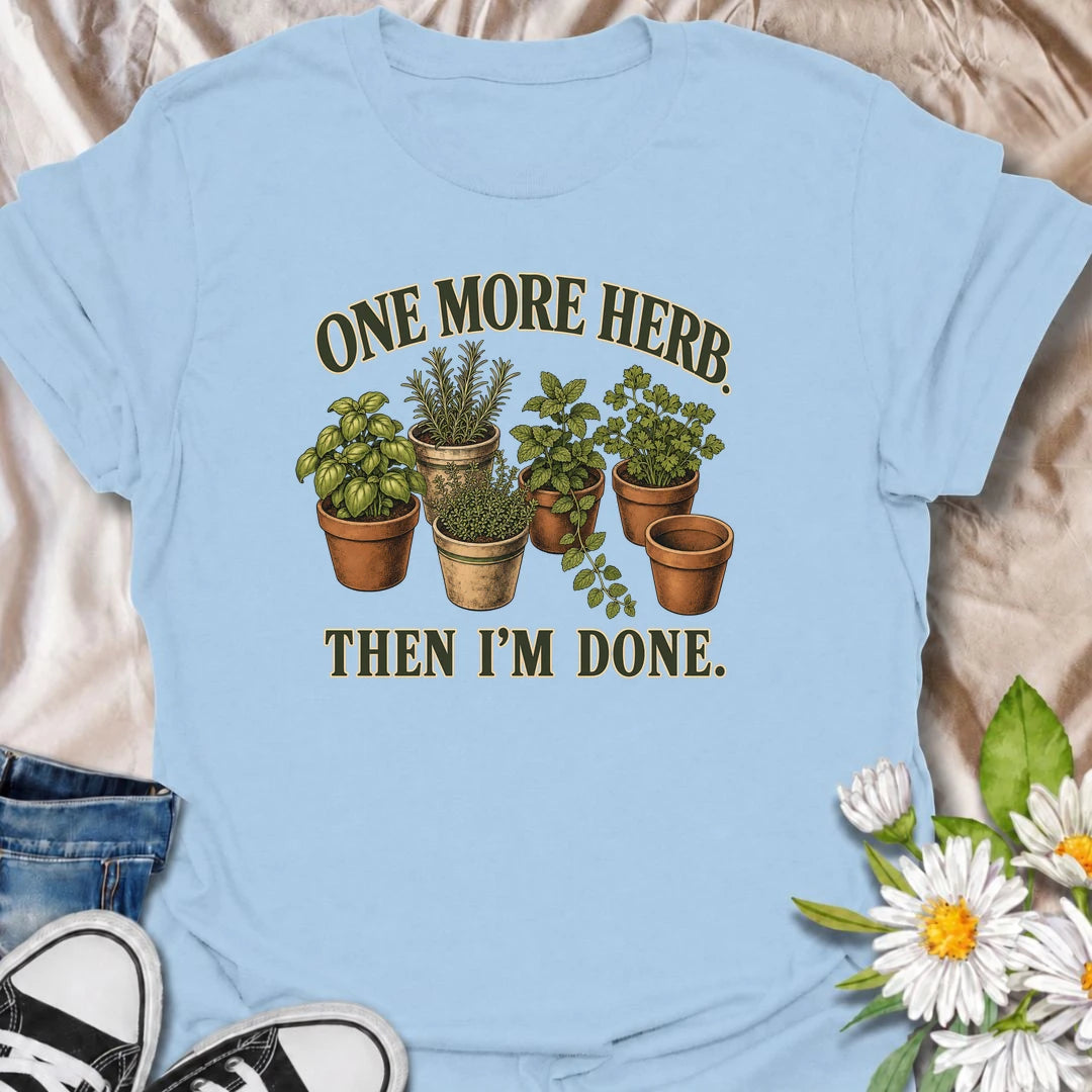 A funny herb garden T-shirt for anyone who keeps promising there is room for just one more pot. Featuring basil, rosemary, mint, thyme, and parsley in vintage-style planters, this design is perfect for kitchen gardeners and herb lovers. The phrase “One More Herb. Then I’m Done.” captures the very familiar habit of turning a small herb collection into an ever-growing one. It makes a great gift for home cooks, container gardeners, and anyone who loves growing fresh herbs. Ideal for gardening days, farmers mar