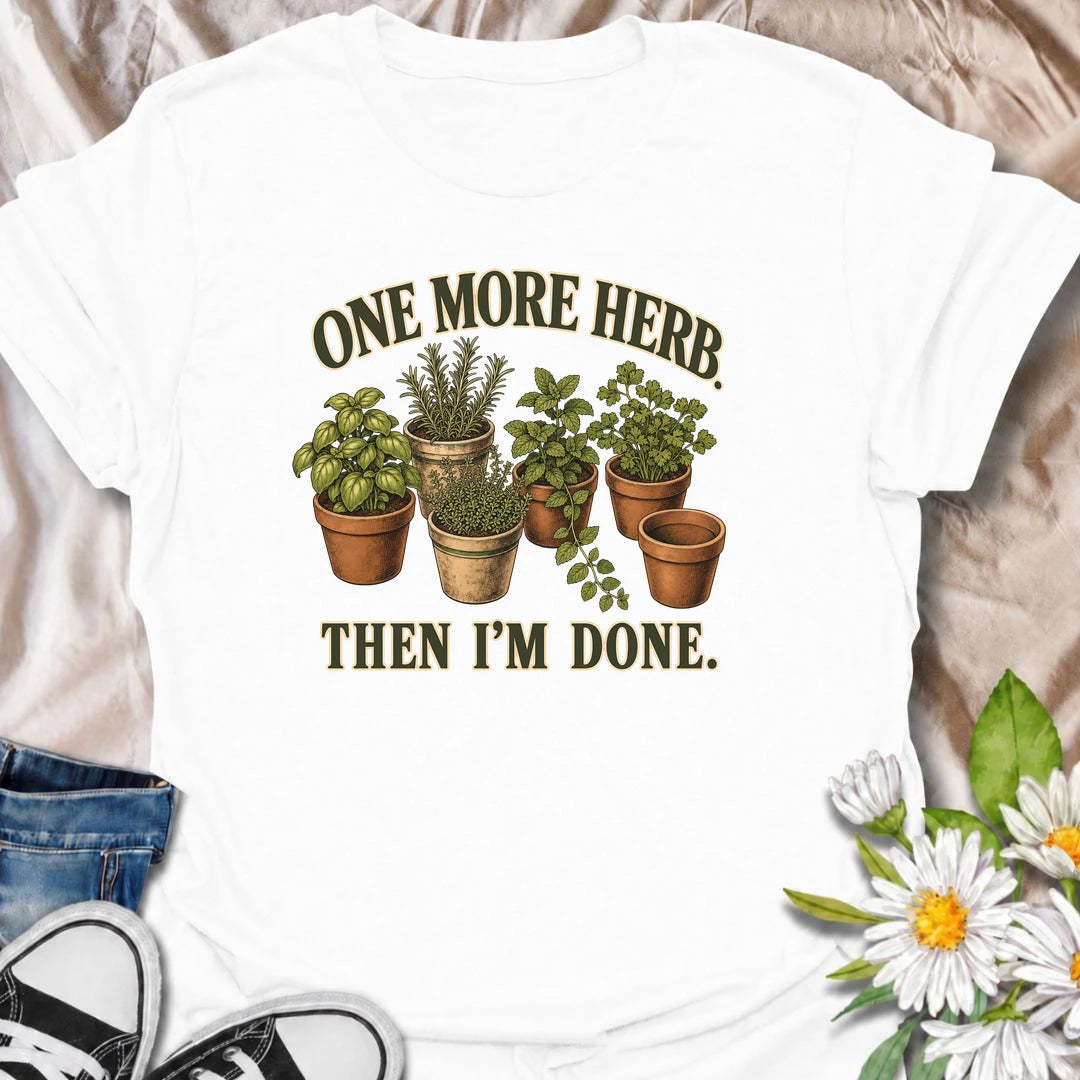 A funny herb garden T-shirt for anyone who keeps promising there is room for just one more pot. Featuring basil, rosemary, mint, thyme, and parsley in vintage-style planters, this design is perfect for kitchen gardeners and herb lovers. The phrase “One More Herb. Then I’m Done.” captures the very familiar habit of turning a small herb collection into an ever-growing one. It makes a great gift for home cooks, container gardeners, and anyone who loves growing fresh herbs. Ideal for gardening days, farmers mar