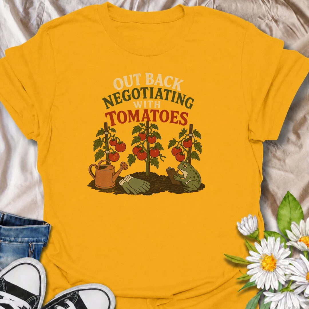 A funny gardening T-shirt for tomato growers who know every plant seems to have its own demands. Featuring ripe tomato plants, gardening tools, and a very serious frog taking notes, this design is perfect for vegetable gardeners with a sense of humor. The “Out Back Negotiating With Tomatoes” phrase makes a fun gift for backyard growers, allotment gardeners, and anyone who spends more time talking to plants than people. Great for garden days, farmers markets, greenhouse visits, or relaxing in the backyard. A