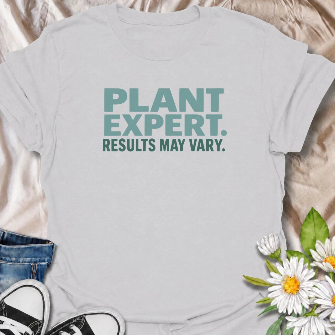 A funny plant T-shirt for anyone who gives great houseplant advice but knows the results are never guaranteed. The phrase “Plant Expert. Results May Vary.” adds dry, self-deprecating humor without overcomplicating the design. Perfect for plant parents, houseplant collectors, indoor gardeners, and anyone who has learned that every plant has a mind of its own. The clean typography makes it an easy everyday shirt and a fun gift for experienced growers and enthusiastic beginners alike. Ideal for nursery trips, 