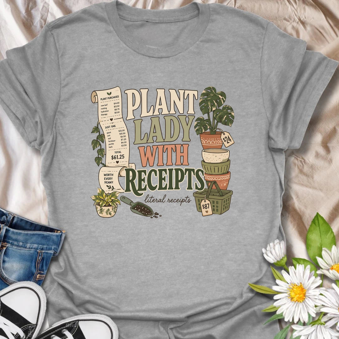 A funny plant shopping T-shirt for anyone with a long paper trail from the local nursery. The design features oversized receipts, decorative pots, plant baskets, potting soil, and an impressive new houseplant purchase. A perfect gift for plant ladies, nursery shoppers, and collectors who know every plant is worth the price.