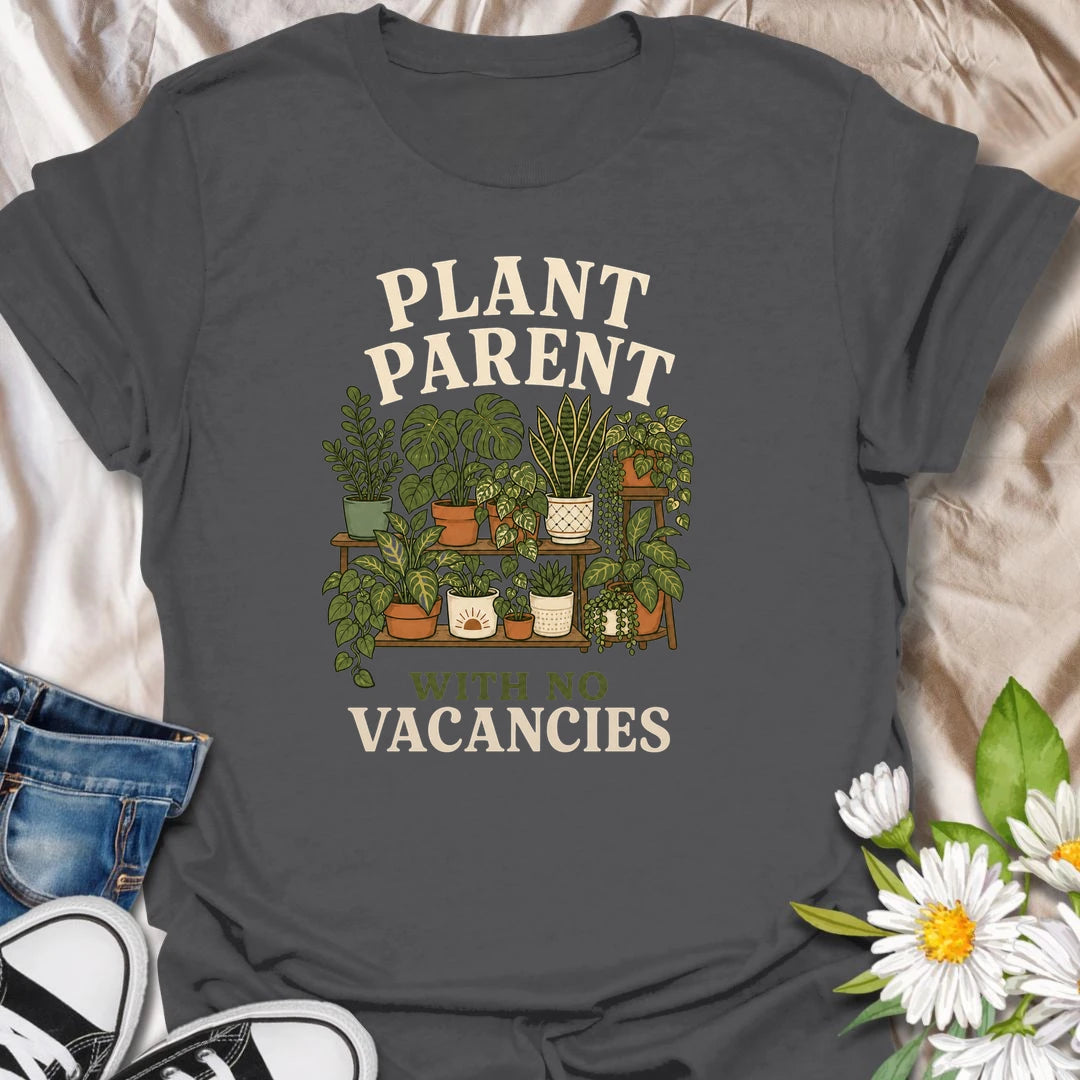 Plant Parent t-shirt for houseplant lovers whose home is already full, but somehow there is always room for one more.
The vintage plant shelf design features potted greenery, plant tags, and a funny “with no vacancies” message.
It is perfect for plant moms, plant dads, houseplant collectors, and indoor gardeners with a growing plant family.
A fun gift for anyone whose shelves, windowsills, and corners are officially occupied by plants.