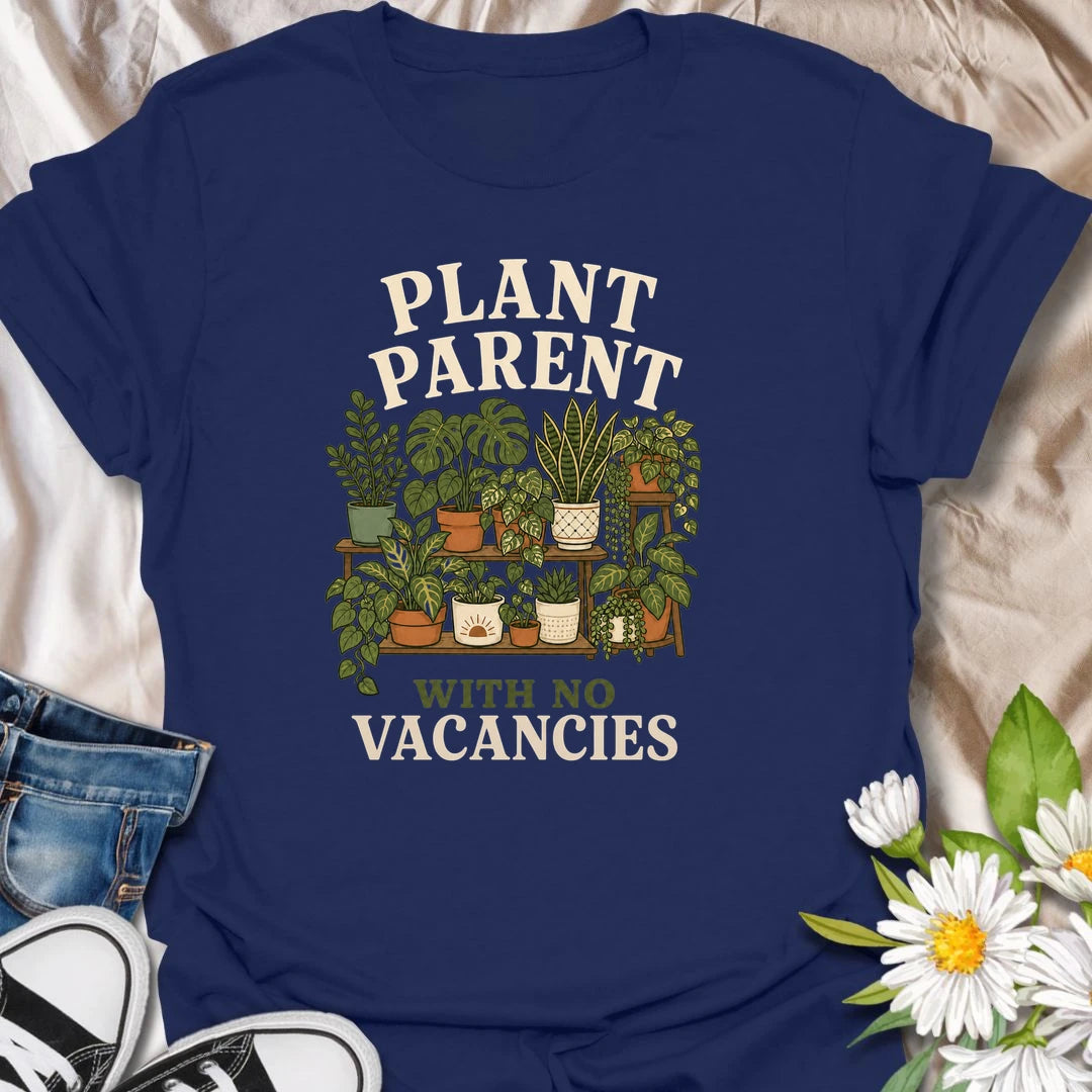 Plant Parent t-shirt for houseplant lovers whose home is already full, but somehow there is always room for one more.
The vintage plant shelf design features potted greenery, plant tags, and a funny “with no vacancies” message.
It is perfect for plant moms, plant dads, houseplant collectors, and indoor gardeners with a growing plant family.
A fun gift for anyone whose shelves, windowsills, and corners are officially occupied by plants.