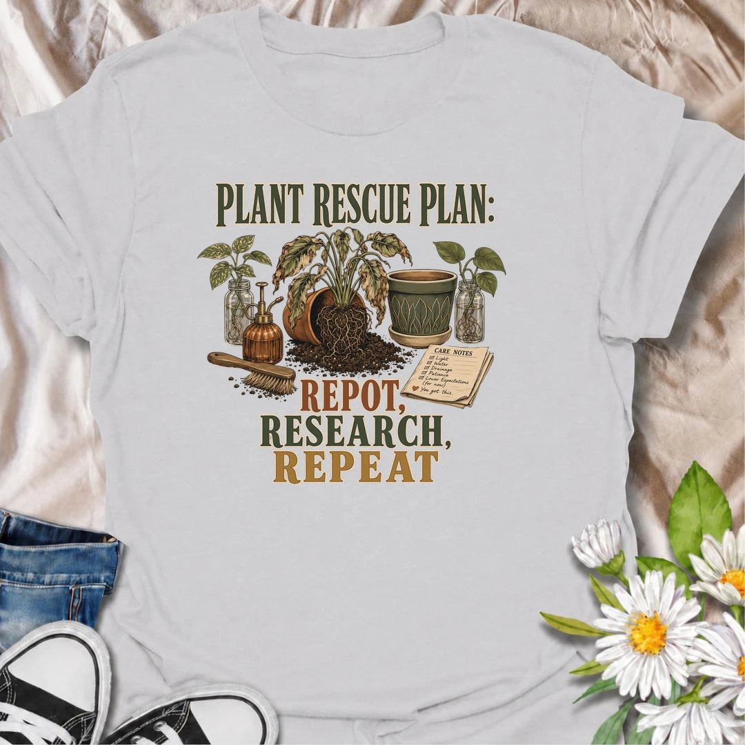 A funny plant rescue T-shirt for dedicated plant parents who repot, research, and repeat. Perfect for houseplant lovers who never give up on a struggling plant.
