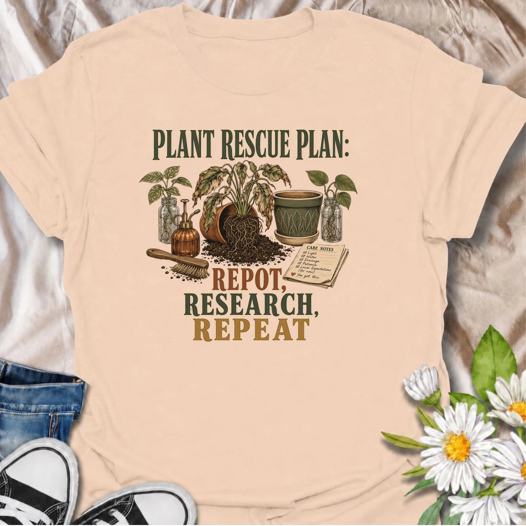 A funny plant rescue T-shirt for dedicated plant parents who repot, research, and repeat. Perfect for houseplant lovers who never give up on a struggling plant.
