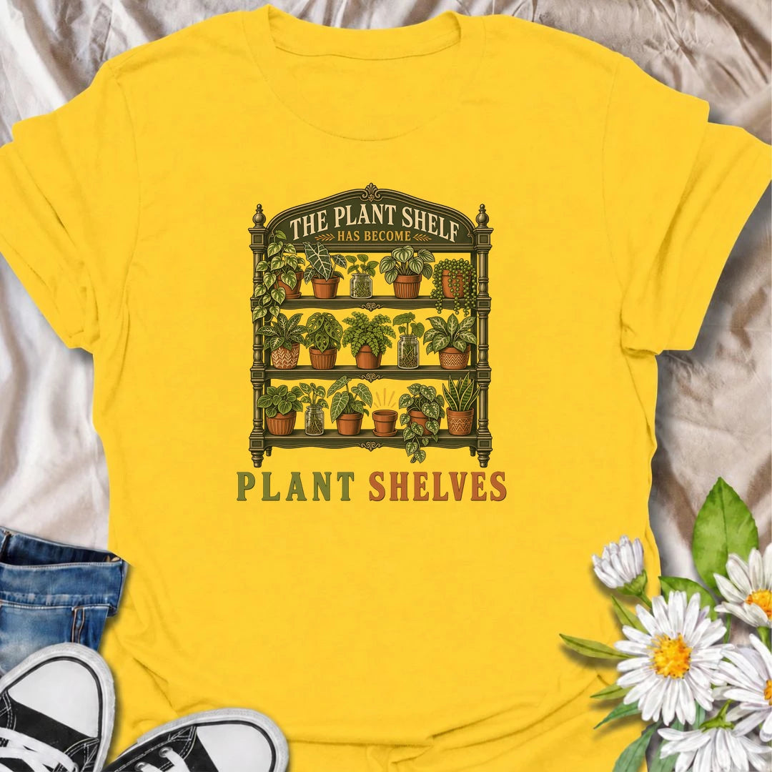 Funny houseplant T-shirt for collectors who started with one small plant shelf and somehow ended up needing several. Featuring a detailed vintage shelving unit packed with houseplants and propagation jars, this design is perfect for indoor gardeners and serious plant collectors.