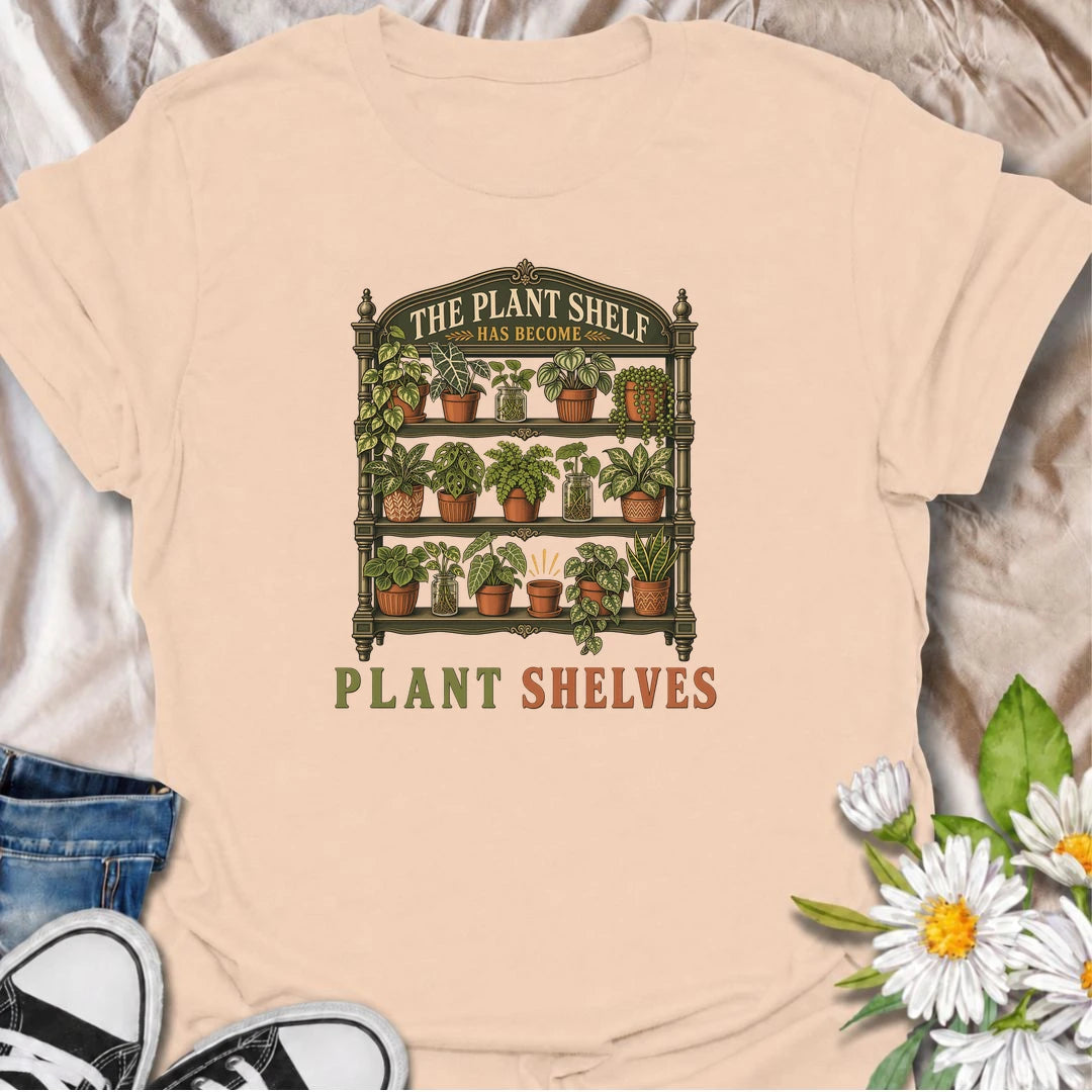 Funny houseplant T-shirt for collectors who started with one small plant shelf and somehow ended up needing several. Featuring a detailed vintage shelving unit packed with houseplants and propagation jars, this design is perfect for indoor gardeners and serious plant collectors.