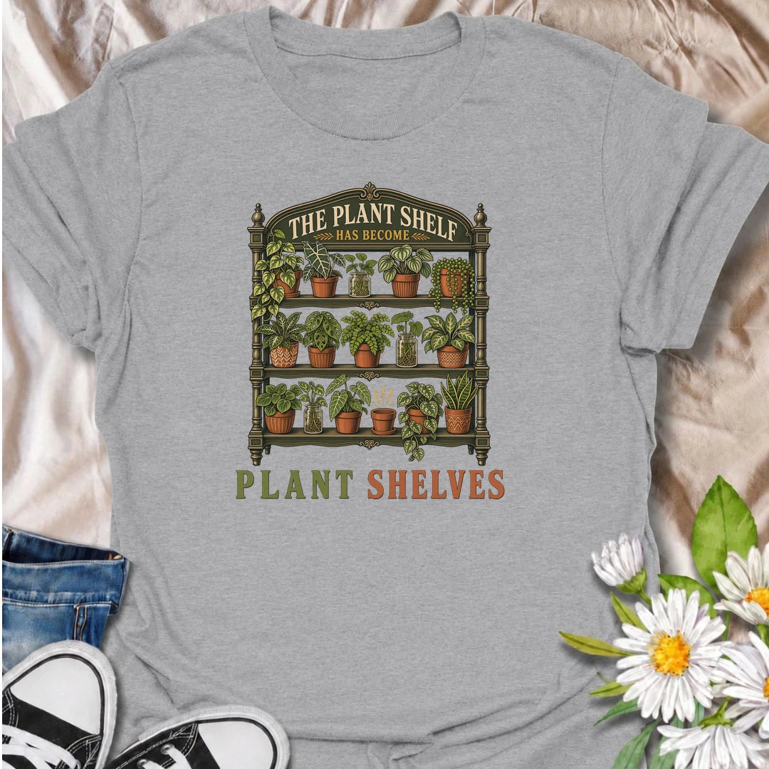 Funny houseplant T-shirt for collectors who started with one small plant shelf and somehow ended up needing several. Featuring a detailed vintage shelving unit packed with houseplants and propagation jars, this design is perfect for indoor gardeners and serious plant collectors.