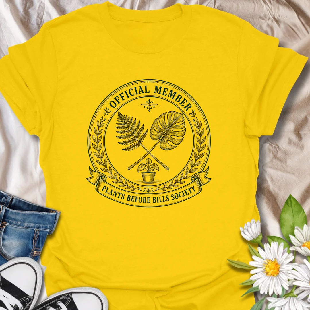 Plants Before Bills t-shirt for plant lovers who know their priorities are leafy, rooted, and usually sitting in a pot.
The official member badge design gives this shirt a vintage botanical society feel with fern, monstera, and potted plant details.
It is perfect for plant moms, houseplant collectors, indoor gardeners, and anyone tempted by plants before responsibilities.
A funny gift for plant people who proudly belong to the plants-before-bills lifestyle.