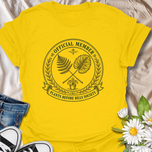 Plants Before Bills t-shirt for plant lovers who know their priorities are leafy, rooted, and usually sitting in a pot.
The official member badge design gives this shirt a vintage botanical society feel with fern, monstera, and potted plant details.
It is perfect for plant moms, houseplant collectors, indoor gardeners, and anyone tempted by plants before responsibilities.
A funny gift for plant people who proudly belong to the plants-before-bills lifestyle.