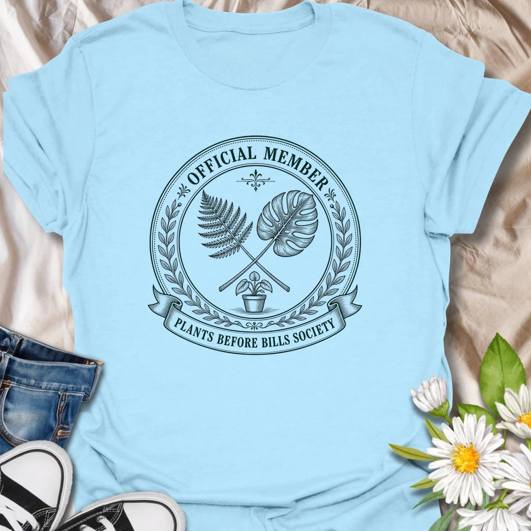 Plants Before Bills t-shirt for plant lovers who know their priorities are leafy, rooted, and usually sitting in a pot.
The official member badge design gives this shirt a vintage botanical society feel with fern, monstera, and potted plant details.
It is perfect for plant moms, houseplant collectors, indoor gardeners, and anyone tempted by plants before responsibilities.
A funny gift for plant people who proudly belong to the plants-before-bills lifestyle.