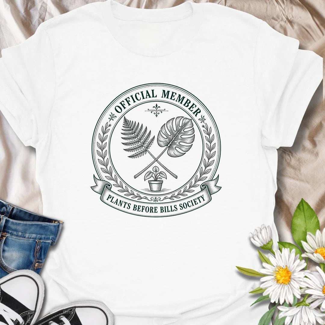 Plants Before Bills t-shirt for plant lovers who know their priorities are leafy, rooted, and usually sitting in a pot.
The official member badge design gives this shirt a vintage botanical society feel with fern, monstera, and potted plant details.
It is perfect for plant moms, houseplant collectors, indoor gardeners, and anyone tempted by plants before responsibilities.
A funny gift for plant people who proudly belong to the plants-before-bills lifestyle.