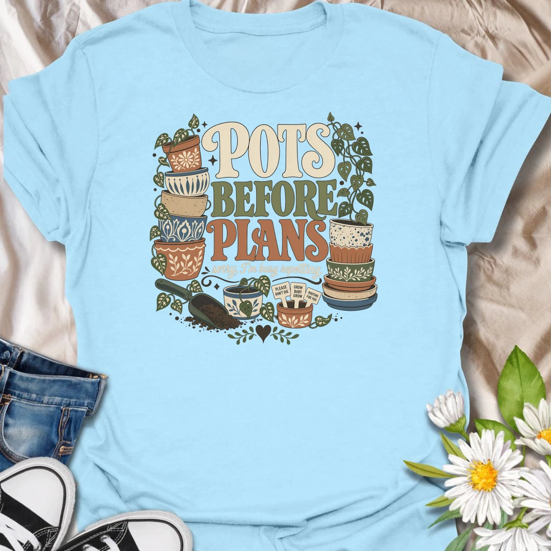 Put repotting first with this playful “Pots Before Plans” T-shirt. Featuring decorative planters, trailing houseplants, potting soil, and tiny plant signs, the design is made for dedicated plant parents. A fun botanical gift for anyone who would happily cancel plans for a repotting session.