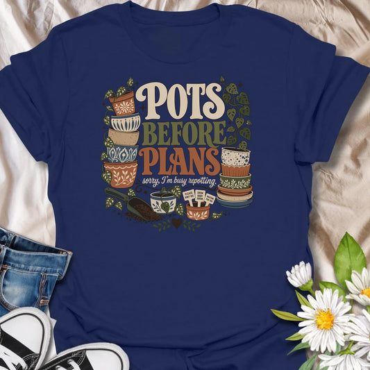 Put repotting first with this playful “Pots Before Plans” T-shirt. Featuring decorative planters, trailing houseplants, potting soil, and tiny plant signs, the design is made for dedicated plant parents. A fun botanical gift for anyone who would happily cancel plans for a repotting session.