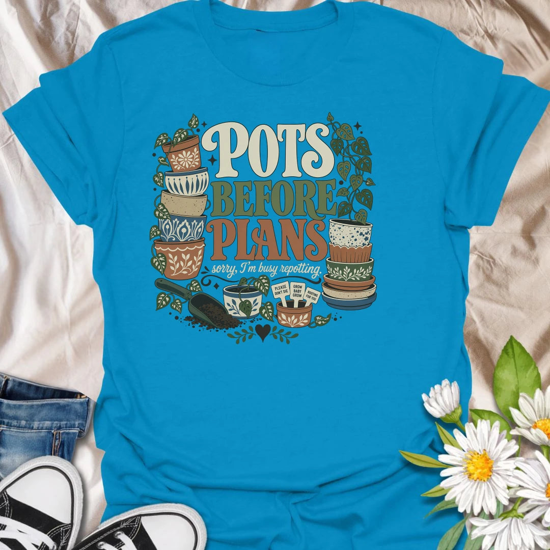 Put repotting first with this playful “Pots Before Plans” T-shirt. Featuring decorative planters, trailing houseplants, potting soil, and tiny plant signs, the design is made for dedicated plant parents. A fun botanical gift for anyone who would happily cancel plans for a repotting session.