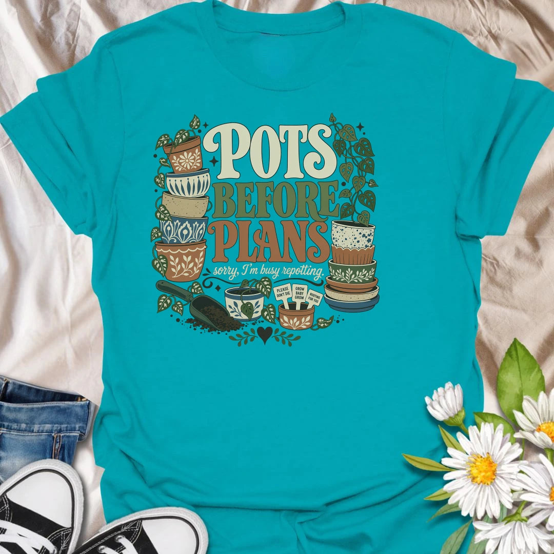 Put repotting first with this playful “Pots Before Plans” T-shirt. Featuring decorative planters, trailing houseplants, potting soil, and tiny plant signs, the design is made for dedicated plant parents. A fun botanical gift for anyone who would happily cancel plans for a repotting session.