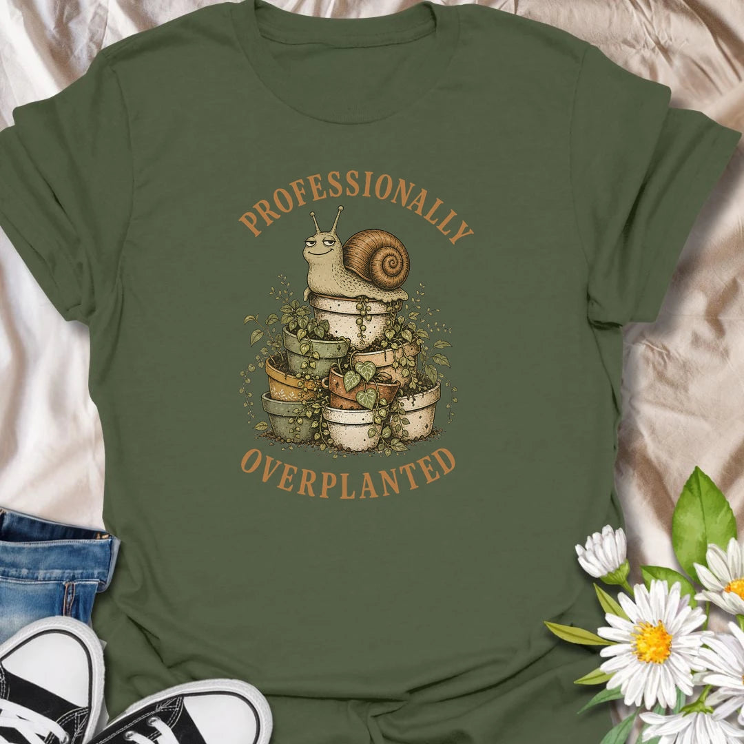 This Professionally Overplanted t-shirt is perfect for gardeners and plant lovers who know there is always room for one more pot. Featuring a smug garden snail sitting on a stack of overflowing potted plants, this funny botanical design is great for houseplant collectors, container gardeners, plant moms, plant dads, and anyone proudly guilty of overplanting.