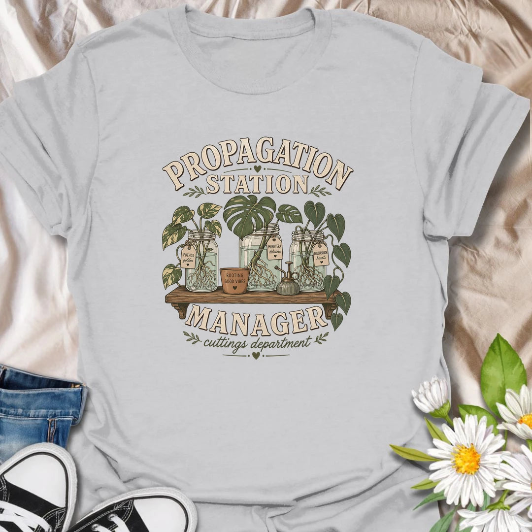 Funny plant propagation t-shirt for anyone fully in charge of the cuttings department.
Features jars of propagating pothos, monstera, and philodendron in a stylish vintage botanical layout.
Perfect for plant parents, propagation lovers, houseplant collectors, and indoor gardeners.