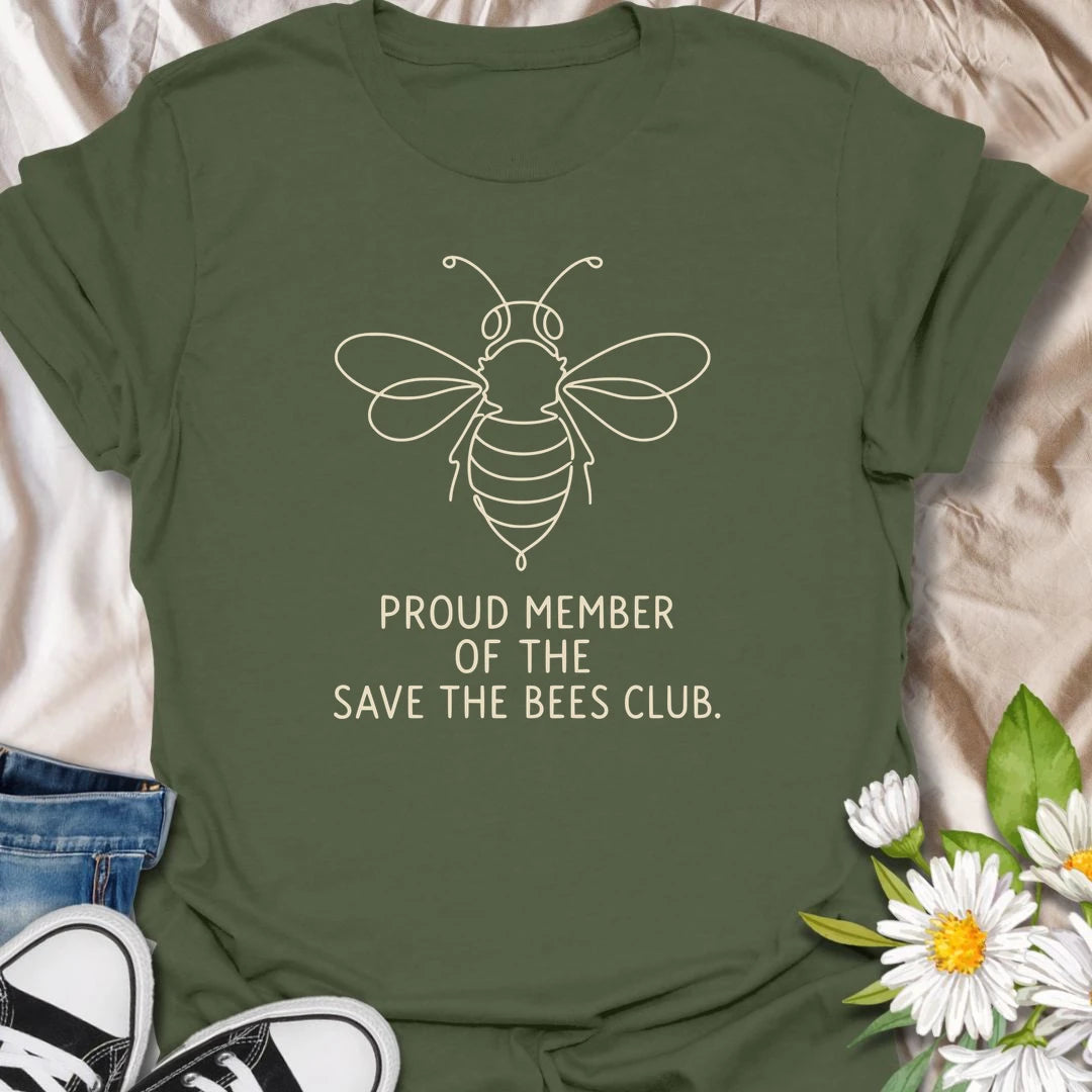 This Proud Member Of The Save The Bees Club t-shirt is perfect for bee lovers, gardeners, and pollinator supporters. Featuring a simple white line-art bee with bold text, this clean botanical design is great for wildflower gardeners, nature lovers, pollinator garden fans, and anyone who wants to celebrate bees and the important work they do.