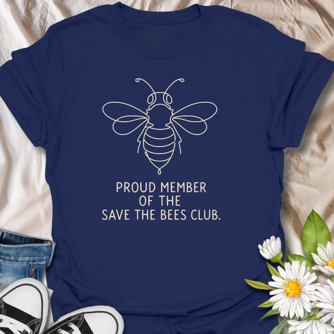 This Proud Member Of The Save The Bees Club t-shirt is perfect for bee lovers, gardeners, and pollinator supporters. Featuring a simple white line-art bee with bold text, this clean botanical design is great for wildflower gardeners, nature lovers, pollinator garden fans, and anyone who wants to celebrate bees and the important work they do.