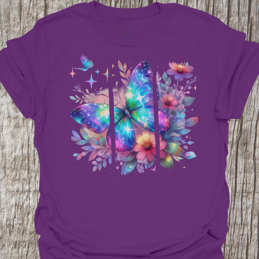 Beutifully serene brushstroke image of butterfly and flowers.  The image is over three separate sections that together make the whole image.  Colors on image are blues, purples, pnks, yellows, and some grey/silver.
The image is printed on a purple t-shirt.