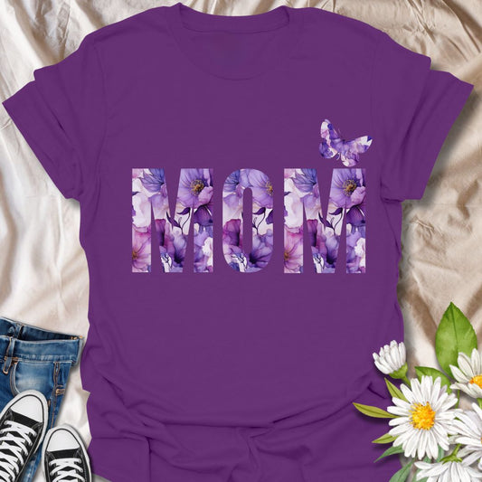 Beautiful floral “MOM” t-shirt with elegant purple and pink watercolor blooms and a butterfly accent. Perfect Mother's Day gift or everyday wear for plant moms, flower lovers, and garden enthusiasts. Celebrate motherhood with botanical charm.