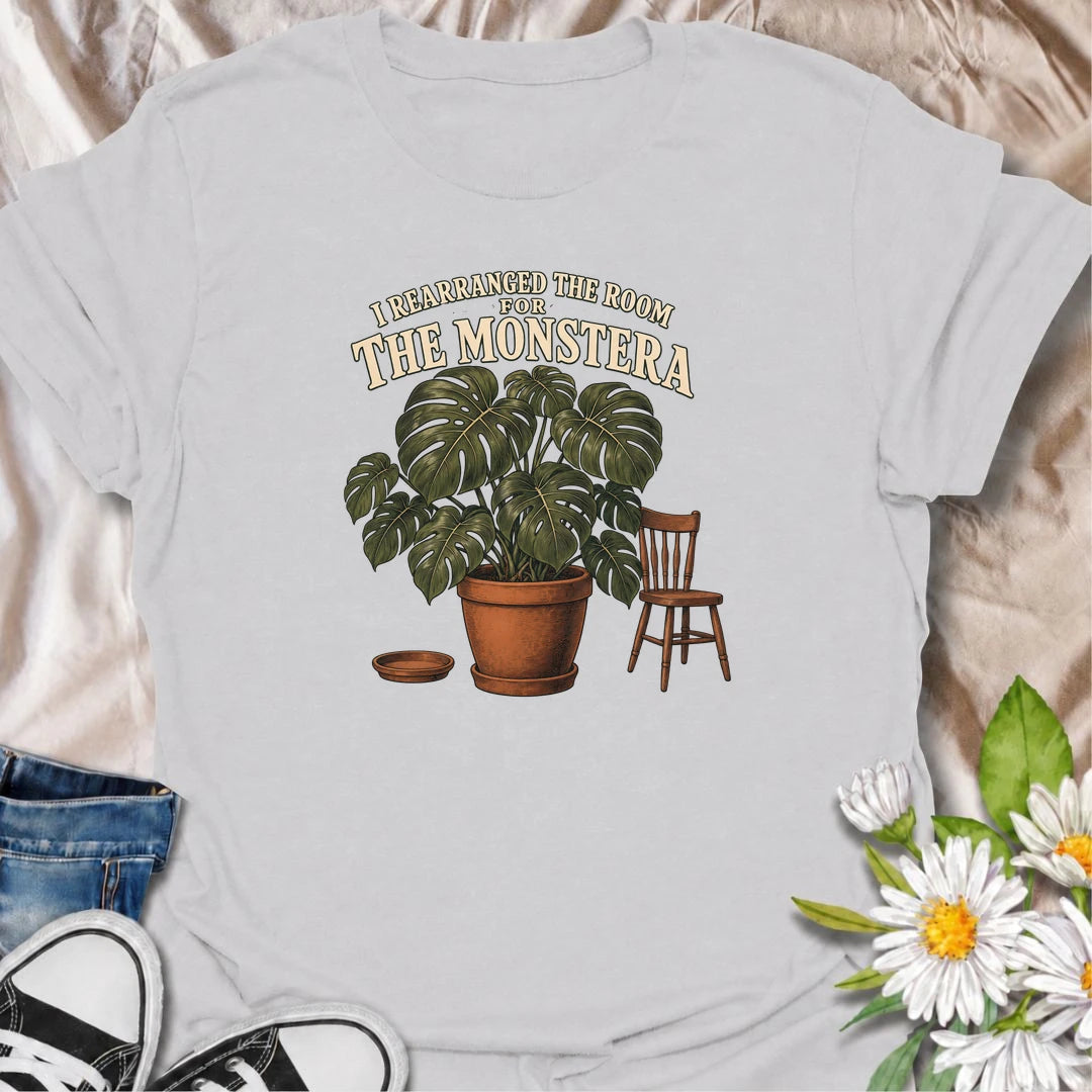 A funny houseplant T-shirt for anyone who has ever reorganized an entire room just to make one plant fit better. Featuring an oversized monstera beside a simple chair, this design is perfect for plant parents who know the furniture sometimes has to adapt to the greenery. The phrase “I Rearranged the Room for the Monstera” captures the reality of living with a rapidly growing indoor jungle. It makes a great gift for monstera lovers, houseplant collectors, and anyone who plans their home around their plants. 