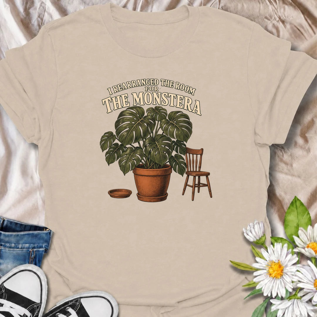 A funny houseplant T-shirt for anyone who has ever reorganized an entire room just to make one plant fit better. Featuring an oversized monstera beside a simple chair, this design is perfect for plant parents who know the furniture sometimes has to adapt to the greenery. The phrase “I Rearranged the Room for the Monstera” captures the reality of living with a rapidly growing indoor jungle. It makes a great gift for monstera lovers, houseplant collectors, and anyone who plans their home around their plants. 