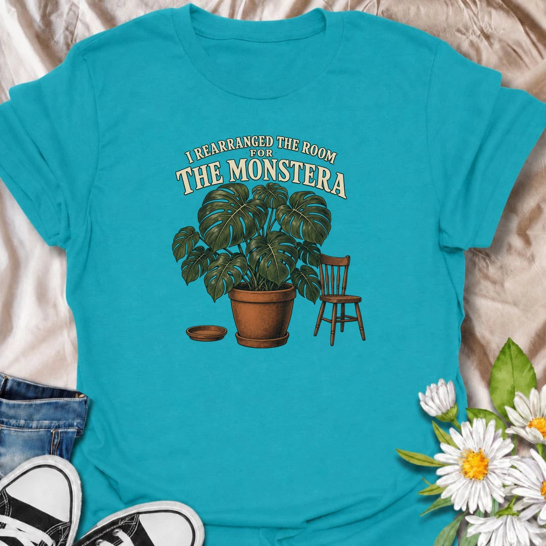 A funny houseplant T-shirt for anyone who has ever reorganized an entire room just to make one plant fit better. Featuring an oversized monstera beside a simple chair, this design is perfect for plant parents who know the furniture sometimes has to adapt to the greenery. The phrase “I Rearranged the Room for the Monstera” captures the reality of living with a rapidly growing indoor jungle. It makes a great gift for monstera lovers, houseplant collectors, and anyone who plans their home around their plants. 