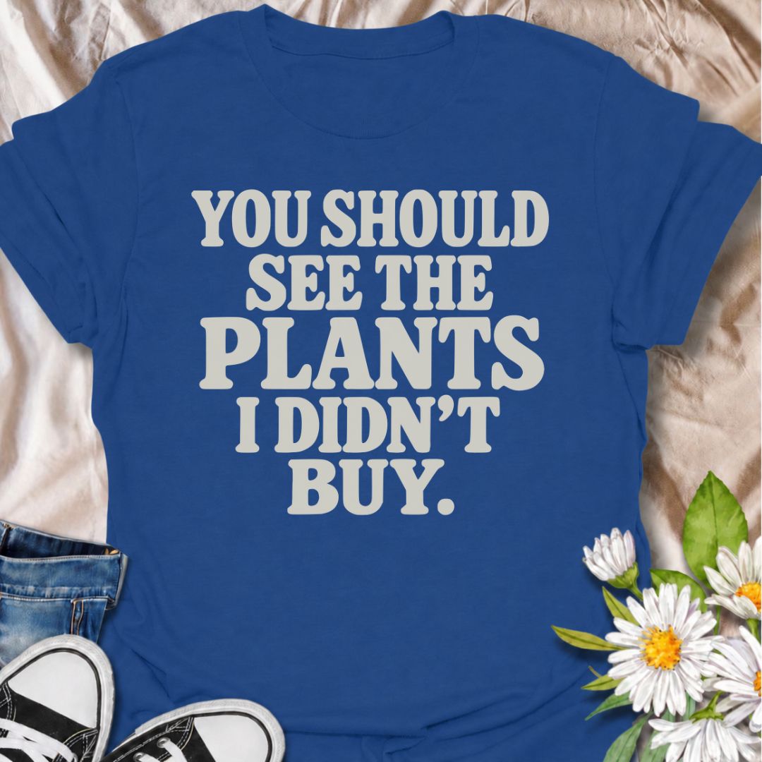 A funny plant T-shirt for anyone whose restraint deserves at least a little recognition. The phrase “You Should See the Plants I Didn’t Buy” delivers dry, self-aware humor that plant parents, nursery regulars, and houseplant collectors will instantly understand. Its bold retro typography keeps the design simple, readable, and easy to wear. It makes a great gift for plant lovers who somehow manage to leave the garden center with fewer plants than they wanted. Perfect for nursery trips, plant swaps, casual we