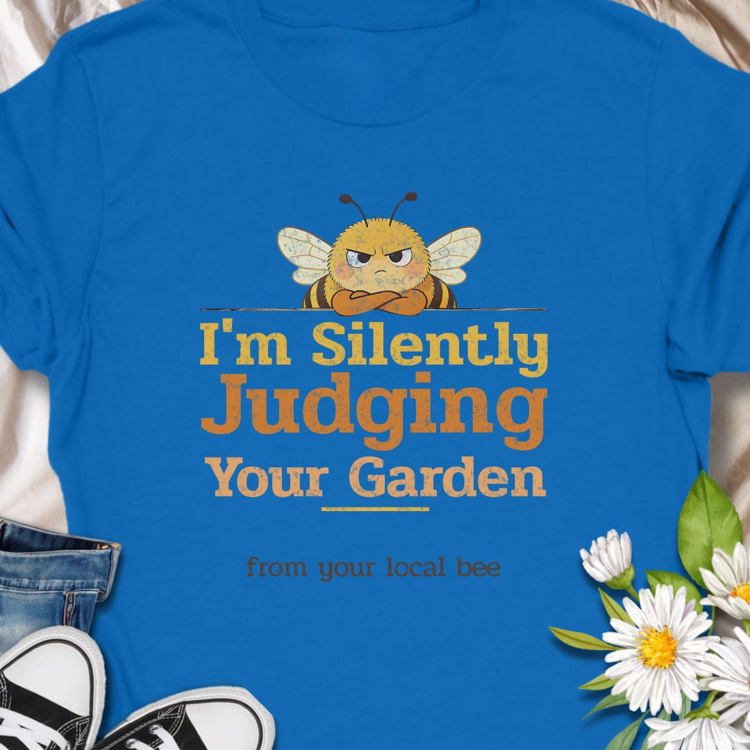 Let your inner bee do the talking with this hilarious “I’m Silently Judging Your Garden” T-shirt featuring a grumpy bee. Perfect for gardeners, plant lovers, and pollinator protectors with a sarcastic sense of humor. A playful gift for bee enthusiasts and backyard botanists alike.