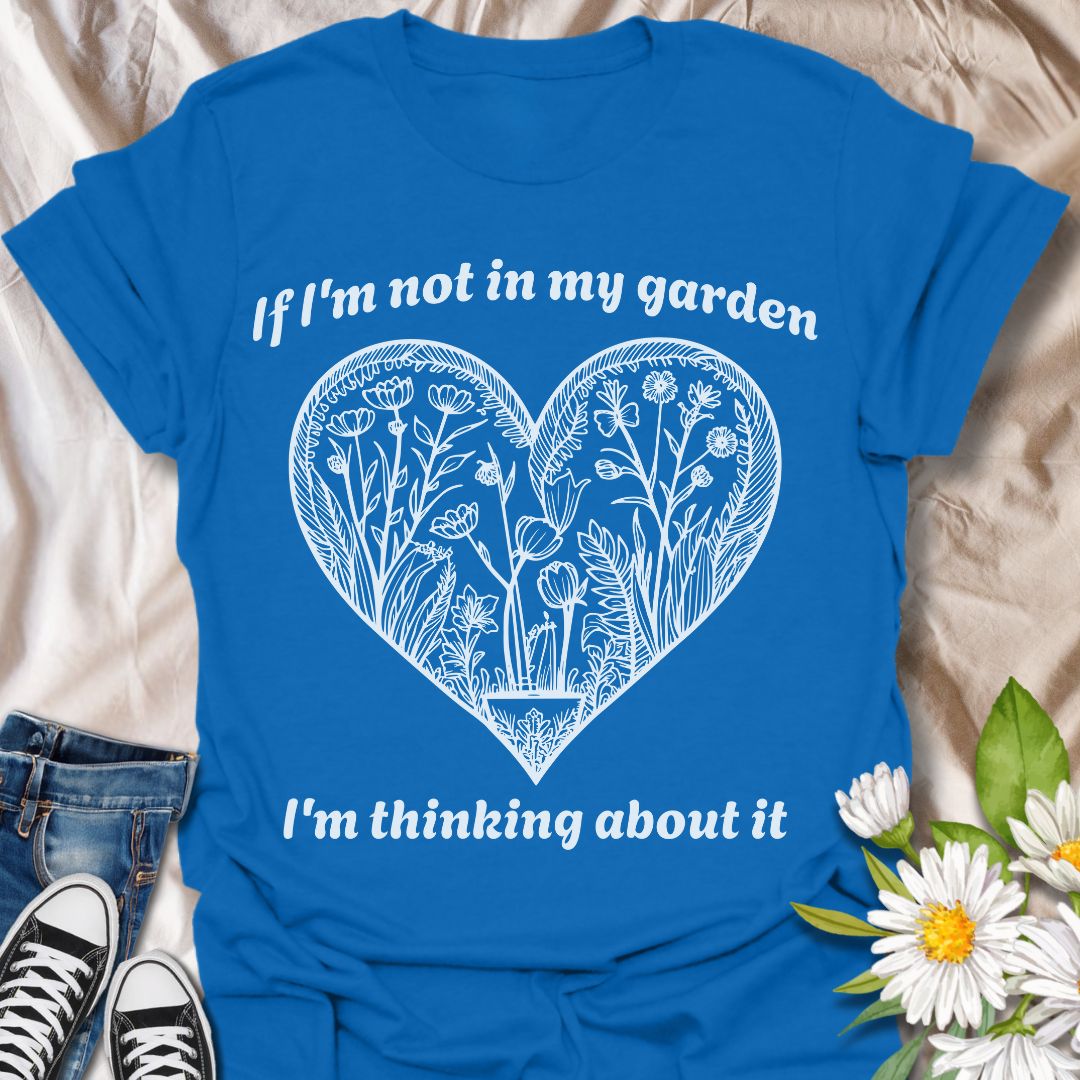 Show off your gardening passion with this beautifully illustrated heart-shaped floral design. Featuring the phrase “If I'm not in my garden, I'm thinking about it,” this shirt is perfect for plant lovers who dream of dirt, blooms, and backyard bliss.