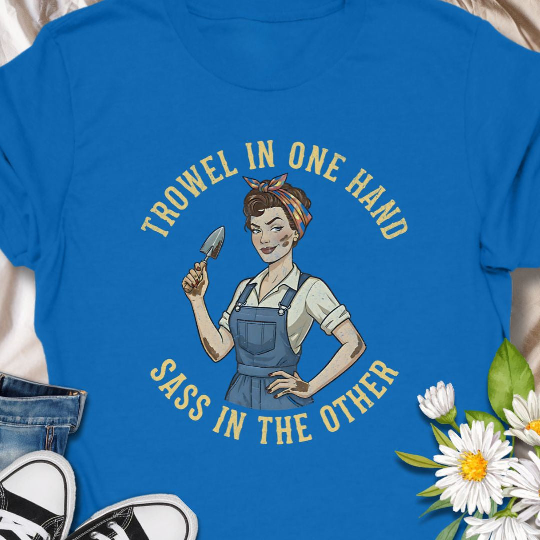 A bold, vintage-inspired gardening t-shirt featuring the phrase “Trowel in One Hand, Sass in the Other.” Perfect for confident gardeners, plant moms, and anyone who loves humor, dirt, and a little attitude in the garden.
