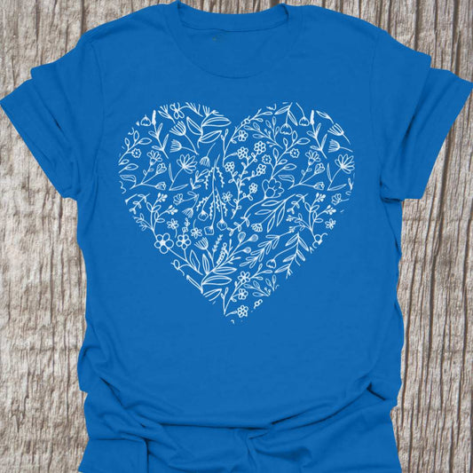 Heart shape filled with flowers all in white, on royal blue t-shirt