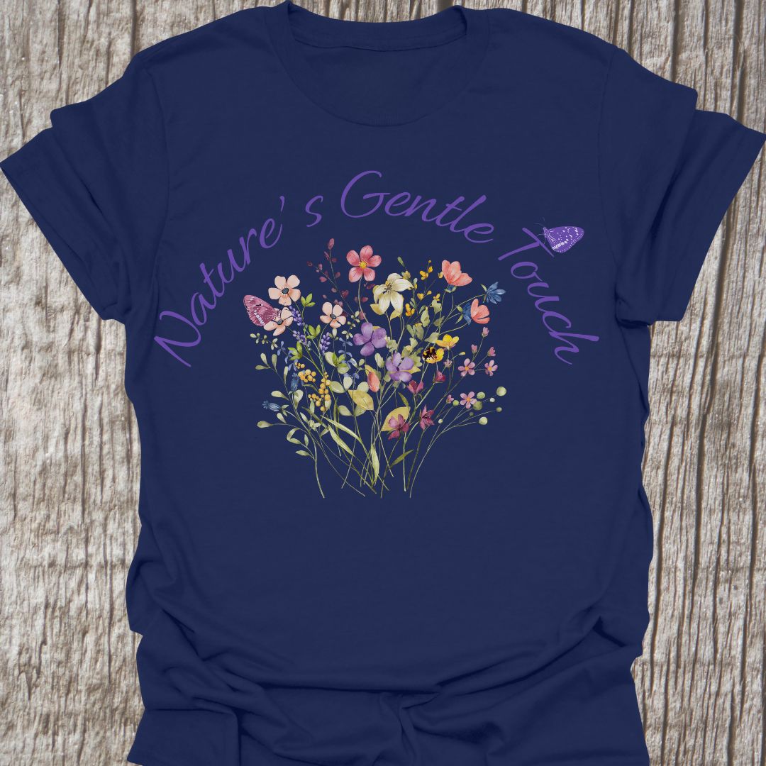 Beautiful flowers navy T-shirt, 'Nature's Gentle Touch' curving around flowers in a lilac font, and a butterfly gently resting within the design.