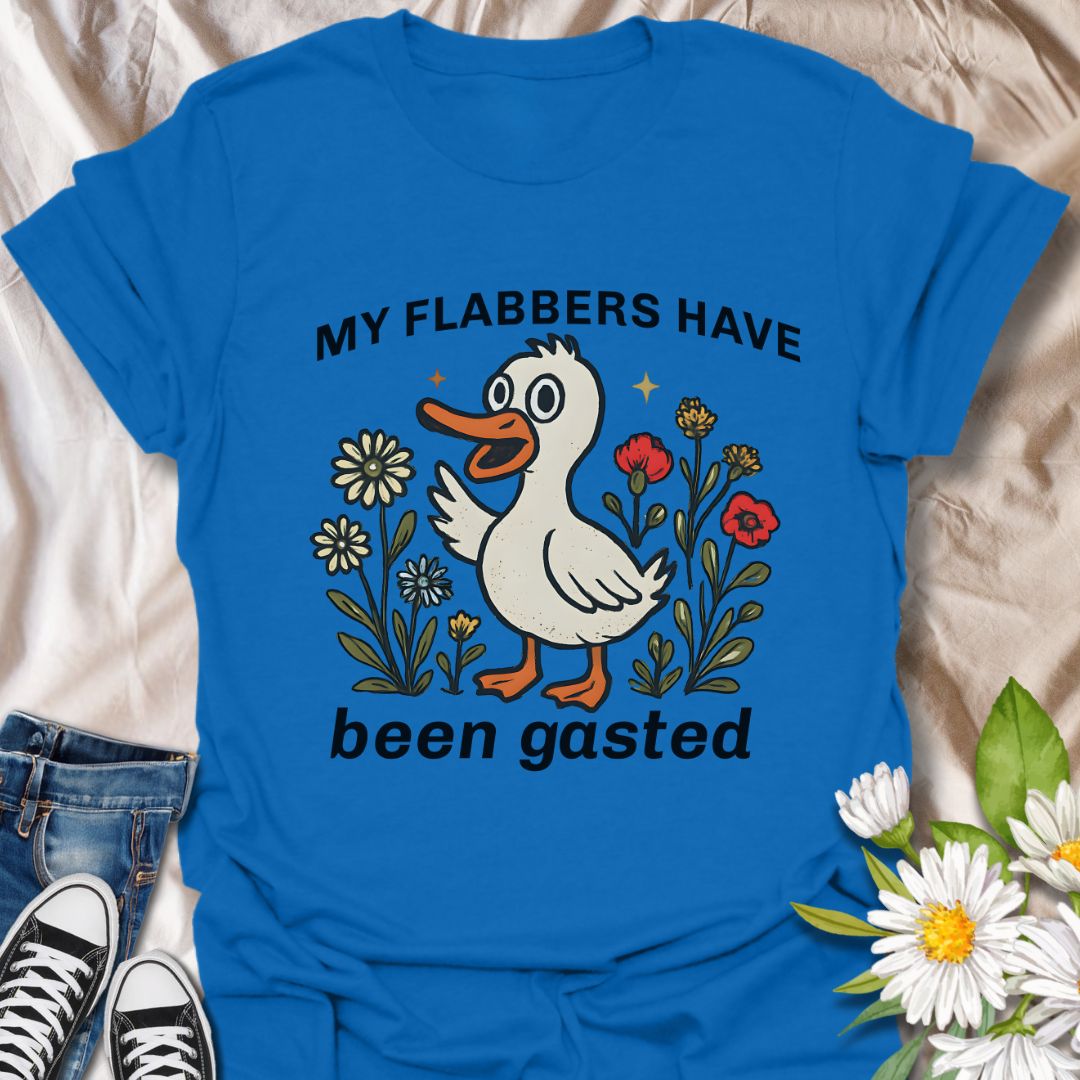 Add a splash of humor to your wardrobe with this quirky “My Flabbers Have Been Gasted” t-shirt featuring an adorable duck and whimsical flowers. A hilarious conversation starter and perfect gift for pun lovers, meme fans, or anyone who appreciates playful and unexpected expressions.