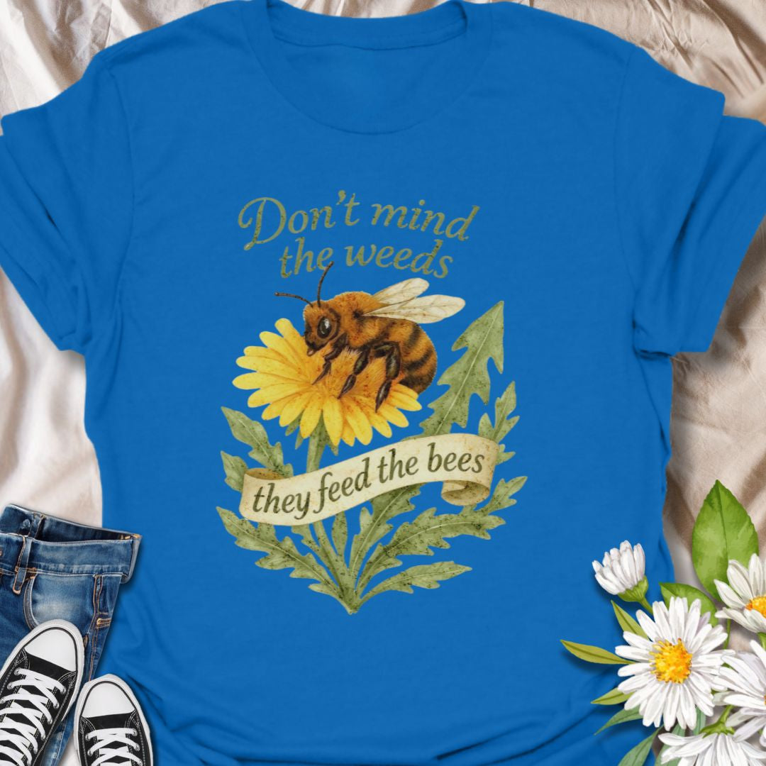 Support pollinators in style with this charming “Don’t Mind the Weeds, They Feed the Bees” t-shirt. Featuring a hand-drawn bee and dandelion artwork, this eco-friendly message tee is perfect for gardeners, nature lovers, and bee advocates who know weeds can be beautiful too.