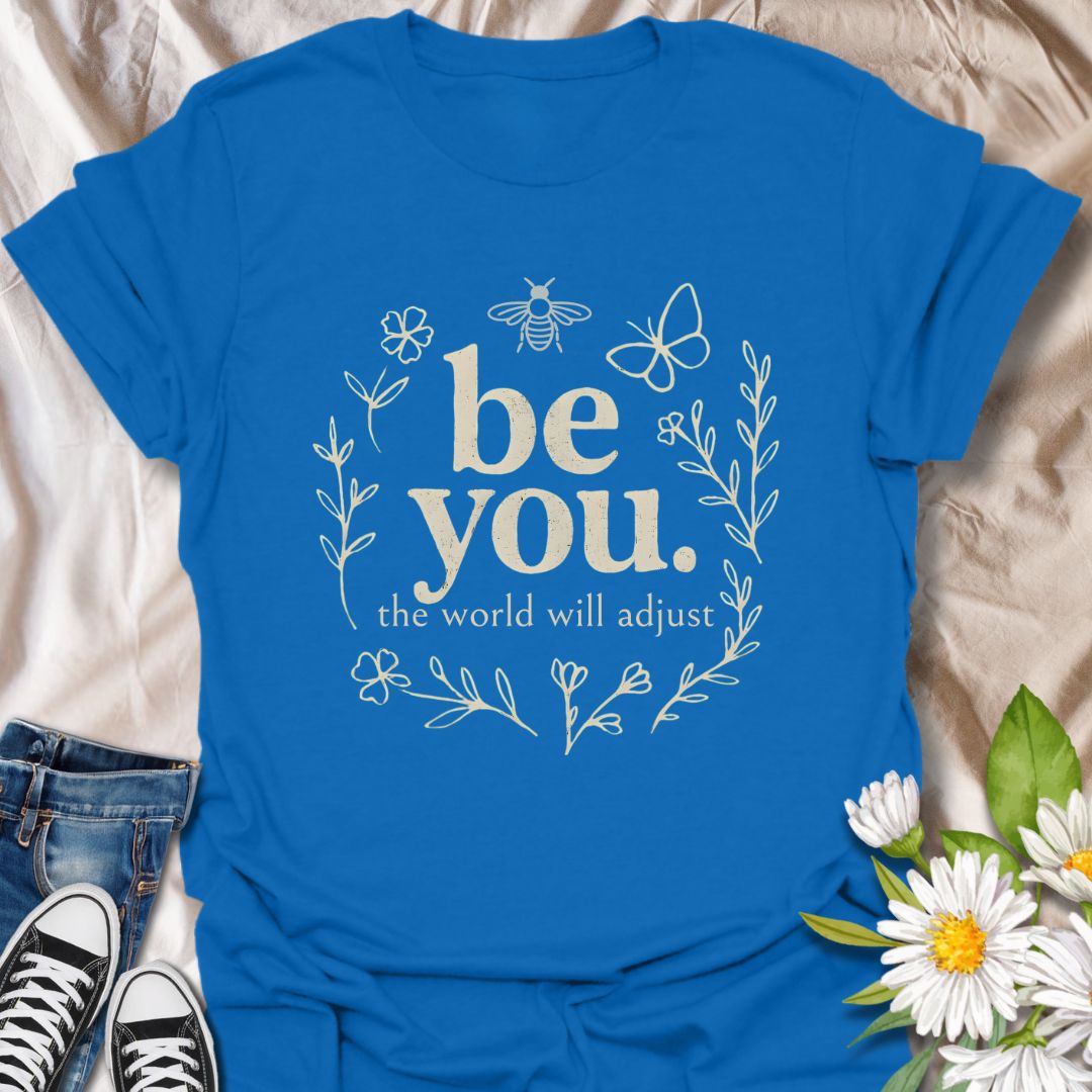Empower your individuality with this inspiring “be you, the world will adjust” t-shirt design. Featuring whimsical floral and nature-themed elements like bees and butterflies, this uplifting graphic tee promotes self-love, confidence, and authenticity — ideal for free spirits and positivity lovers.