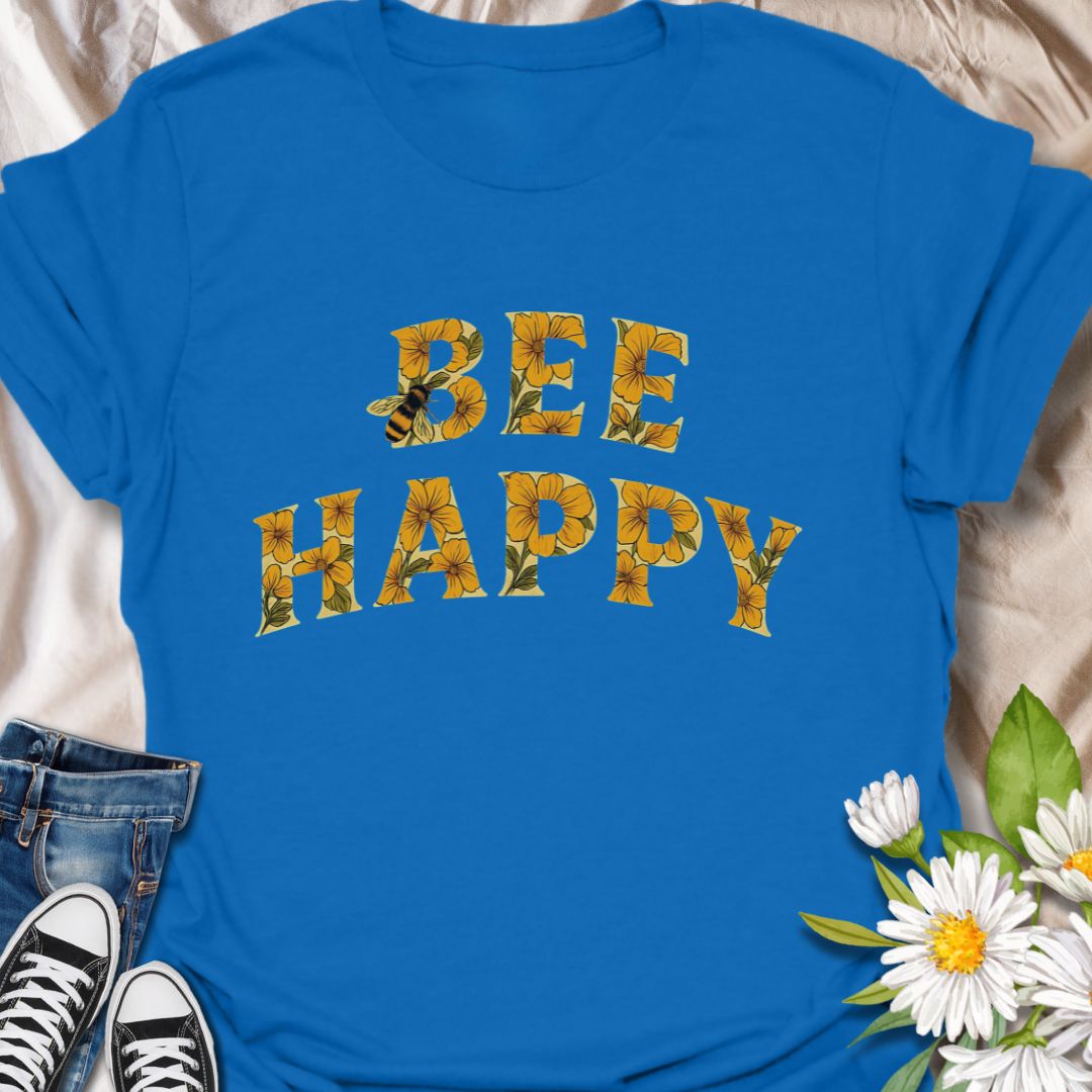 Spread positivity and nature-loving vibes with this charming “Bee Happy” t-shirt, featuring sunflower-filled typography and a playful bee motif. Perfect for beekeepers, garden lovers, and anyone who appreciates cheerful, nature-inspired fashion. A great gift for pollinator advocates and flower enthusiasts.