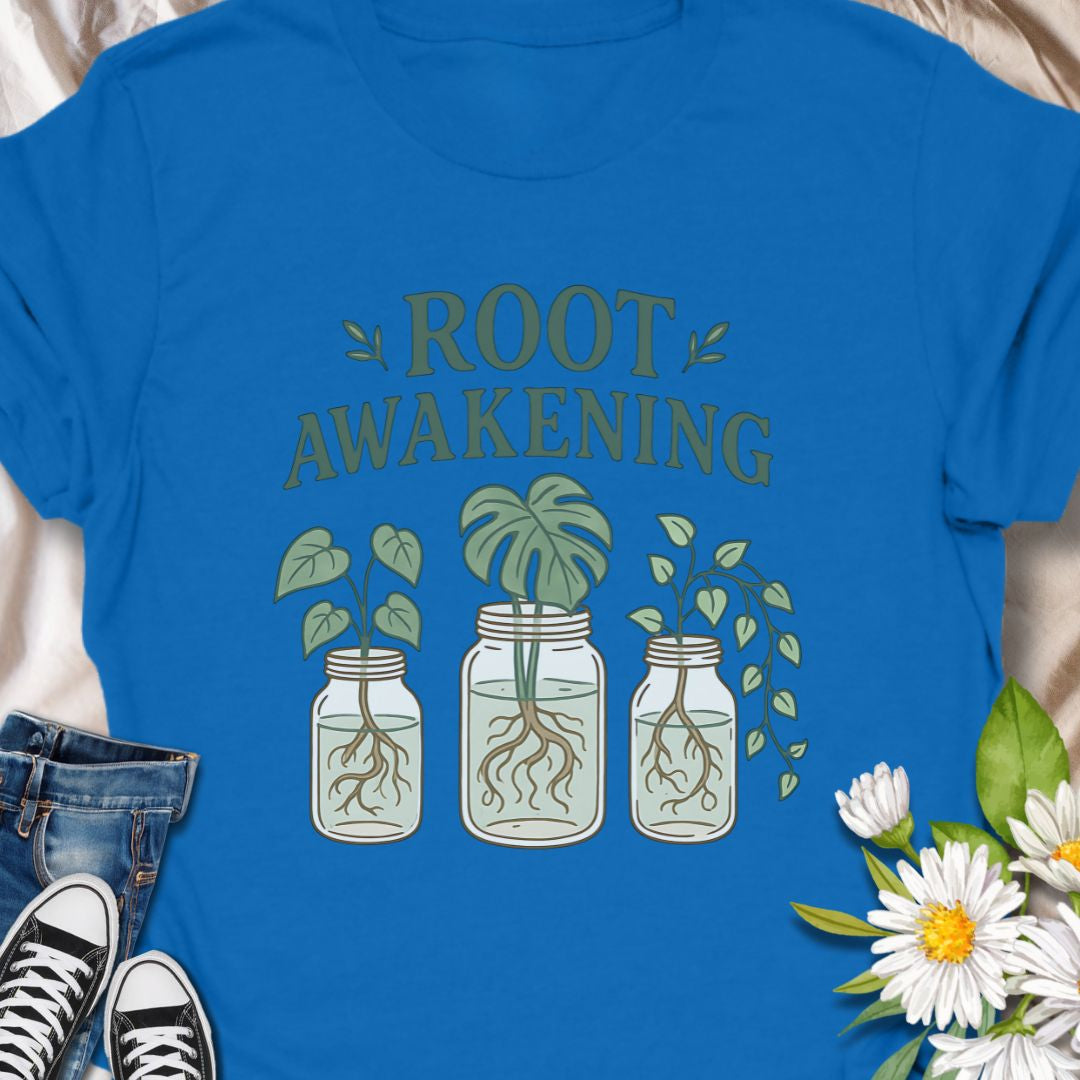 
For plant enthusiasts who love jar propagation, this t-shirt blends clever wordplay with a soft green aesthetic - Soft, lived-in comfort meets quiet green joy. This  tee carries a gentle plant-lover’s message — ‘Root Awakening’ above three mason jars with thriving cuttings and visible roots. The muted greens and hand-drawn lines give it a botanical, cottage-core vibe that reads as calm and intentional. 