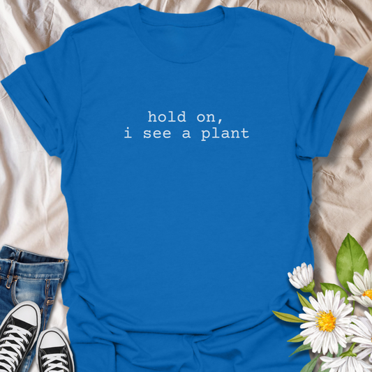Celebrate your love for plants with this witty minimalist tee that reads “hold on, i see a plant.” Perfect for houseplant lovers, garden addicts, and proud plant parents who are always on the lookout for greenery. Simple, stylish, and packed with personality, this shirt is a must-have for anyone whose eyes light up at the sight of a monstera or succulent.