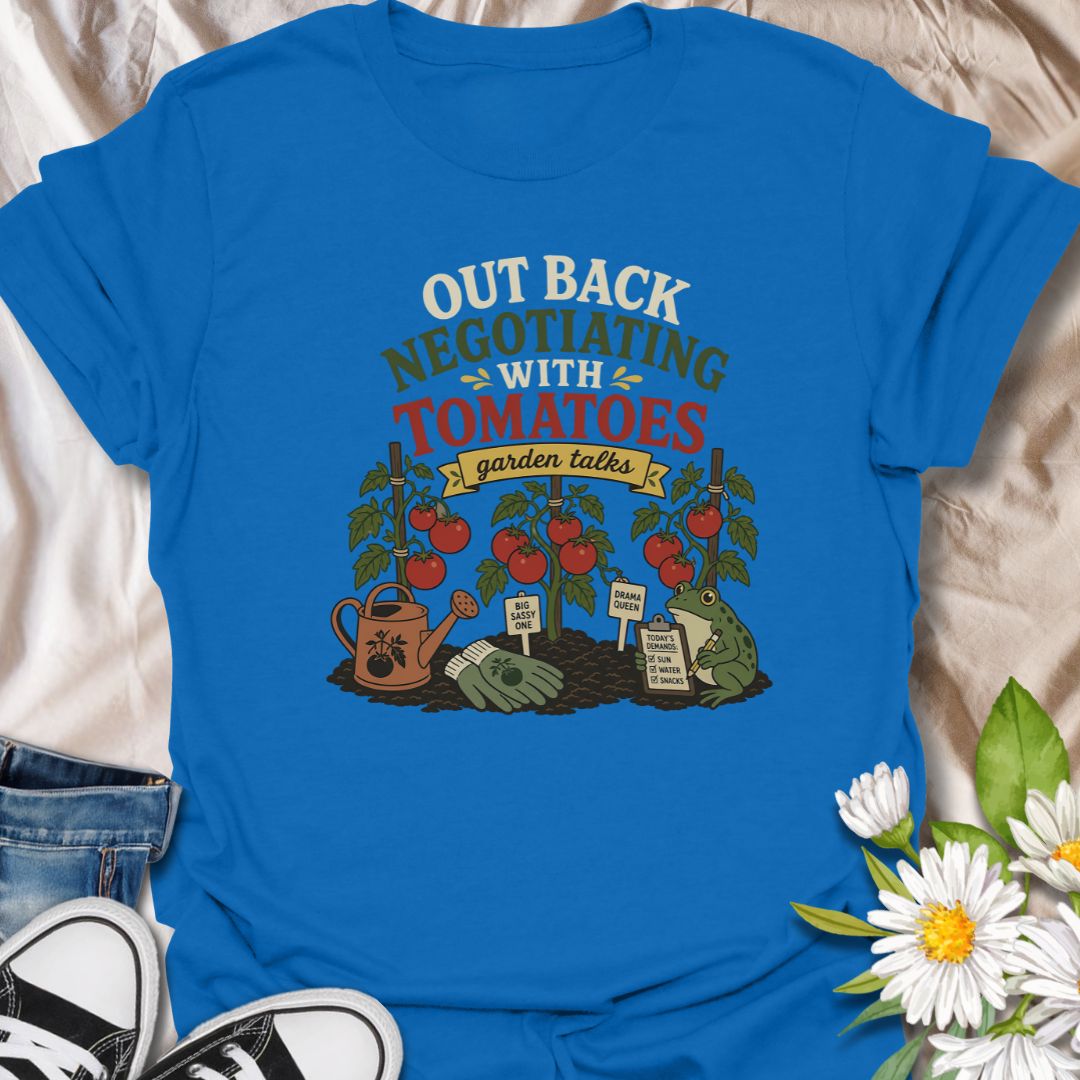 A funny vegetable gardening T-shirt for anyone who spends time discussing terms with their tomato plants. The design features ripe tomatoes, garden tools, plant stakes, and a frog recording the plants’ demands. A playful gift for tomato growers, backyard gardeners, and vegetable garden enthusiasts