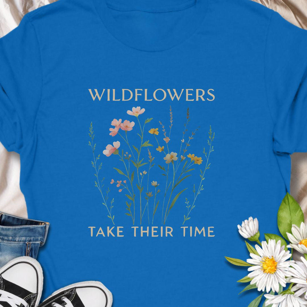 Inspirational wildflower tee featuring soft meadow flowers and motivational quote. A calming nature-themed shirt.