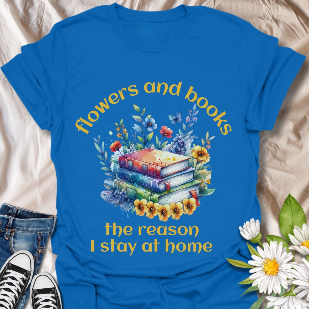 Bookworms and flower lovers unite! This charming t-shirt features a watercolor-style stack of books surrounded by blooms, with the quote “Flowers and books, the reason I stay at home.” A cozy choice for introverts and nature-loving readers.
