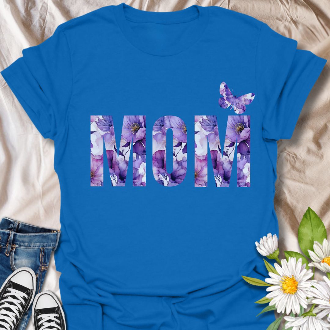 Beautiful floral “MOM” t-shirt with elegant purple and pink watercolor blooms and a butterfly accent. Perfect Mother's Day gift or everyday wear for plant moms, flower lovers, and garden enthusiasts. Celebrate motherhood with botanical charm.