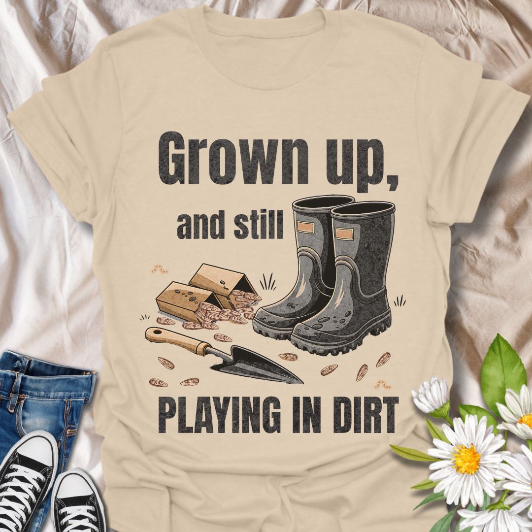 Playfully nostalgic gardening shirt with boots, seeds, and trowel artwork. Ideal for grown-up gardeners who still love getting their hands dirty. A perfect gift for plant lovers with a sense of humor.