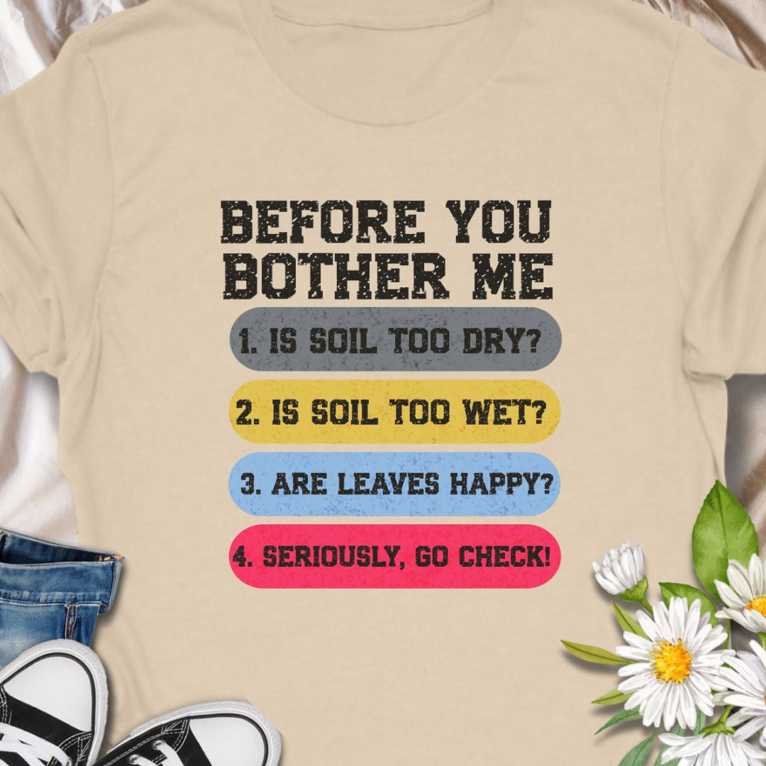 This tee speaks with a wry, green-thumbed voice. The front print lists a gardener’s quick checklist — soil too dry? too wet? are the leaves happy? — finished with a bright, humorous nudge to “go check.” The t-shirt carries a playful, knowledgeable tone that fellow plant lovers will recognize and laugh at.